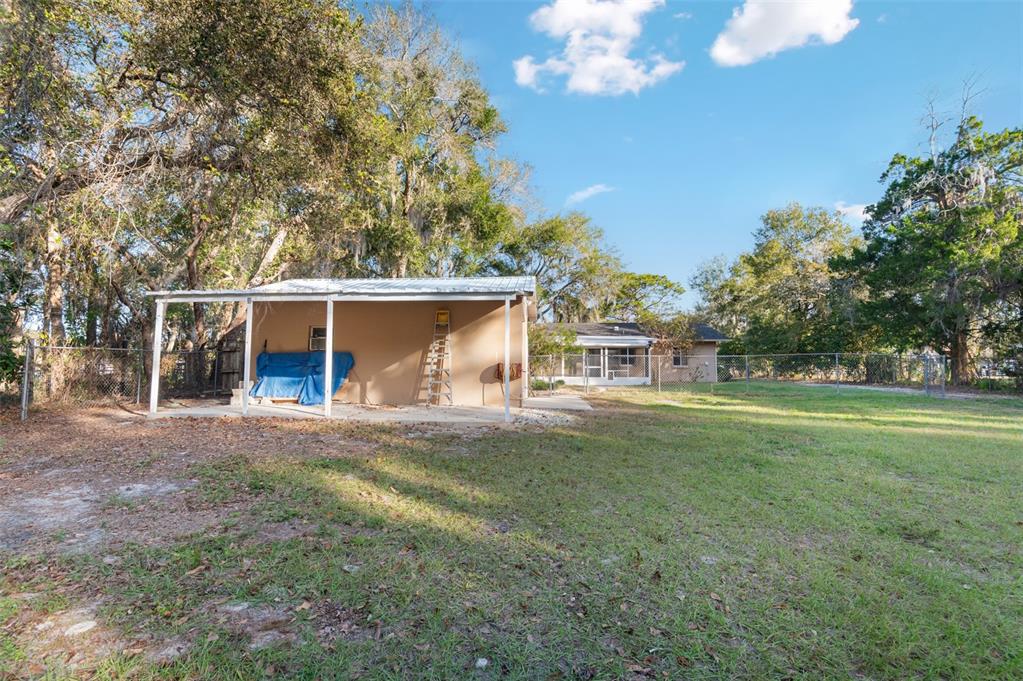 10620 Fawn Drive New Port Richey, FL 34654 - Photo 40 of 49 a front view of a house with a yard and trees