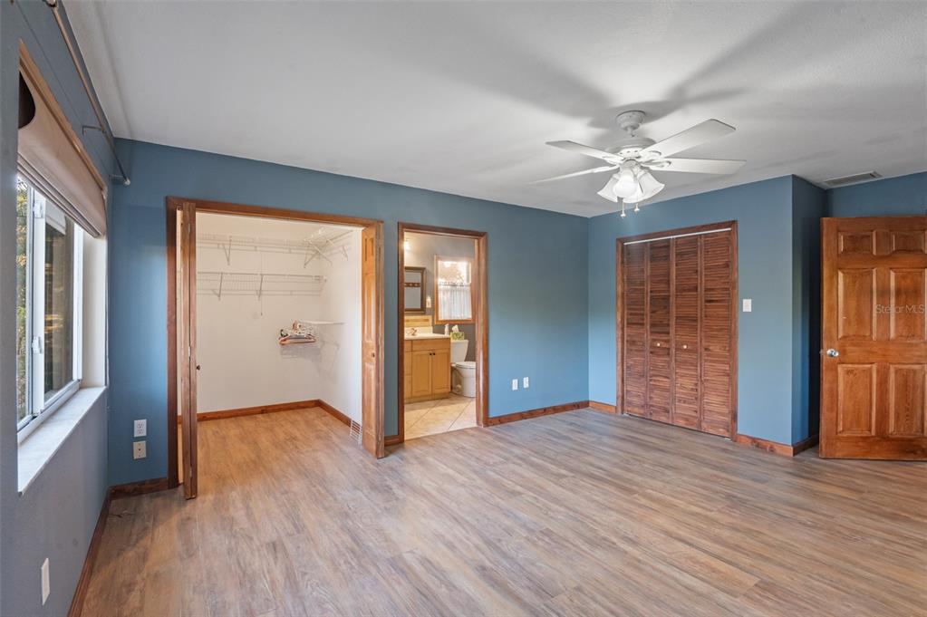 10620 Fawn Drive New Port Richey, FL 34654 - Photo 6 of 49 wooden floor in an empty room with a window