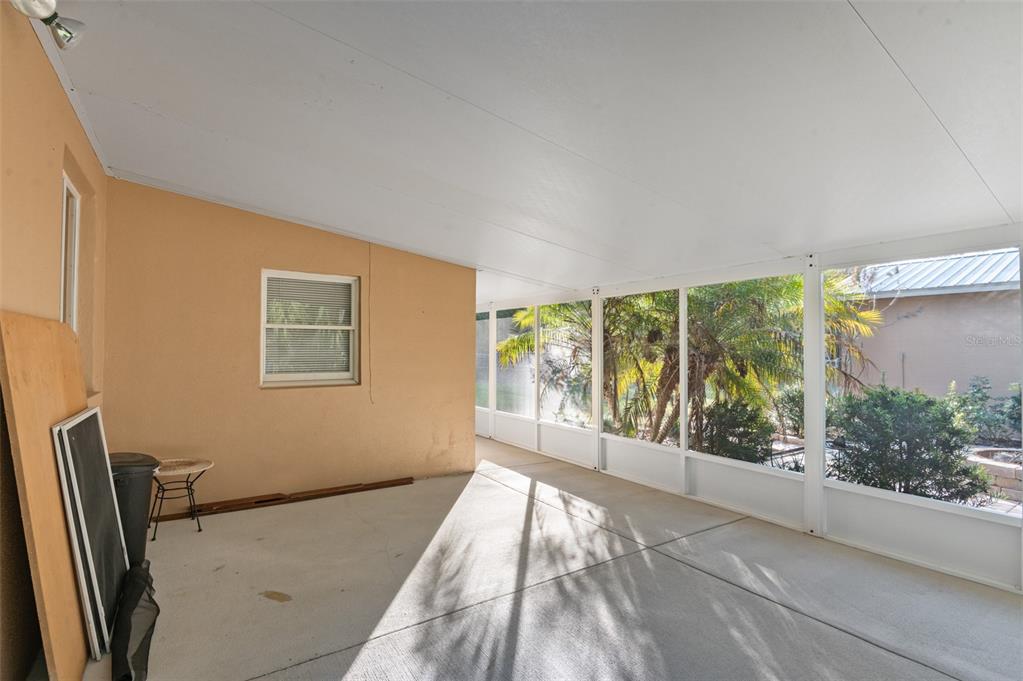 10620 Fawn Drive New Port Richey, FL 34654 - Photo 8 of 49 a view of an empty room with wooden floor and a window