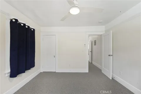 an empty room with closet area