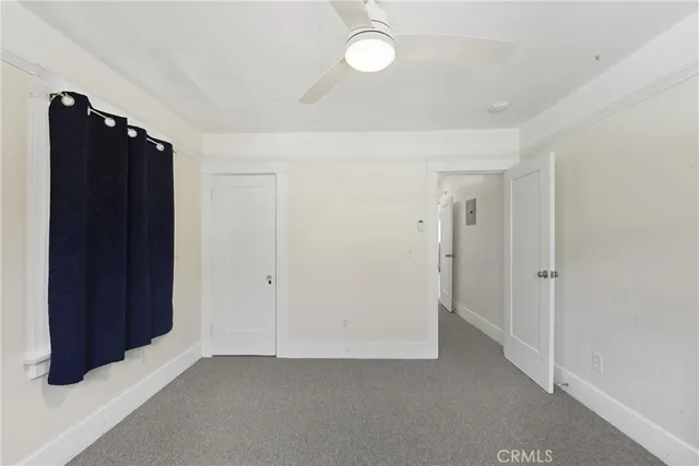 an empty room with closet area