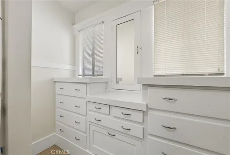 a view of cabinets and window