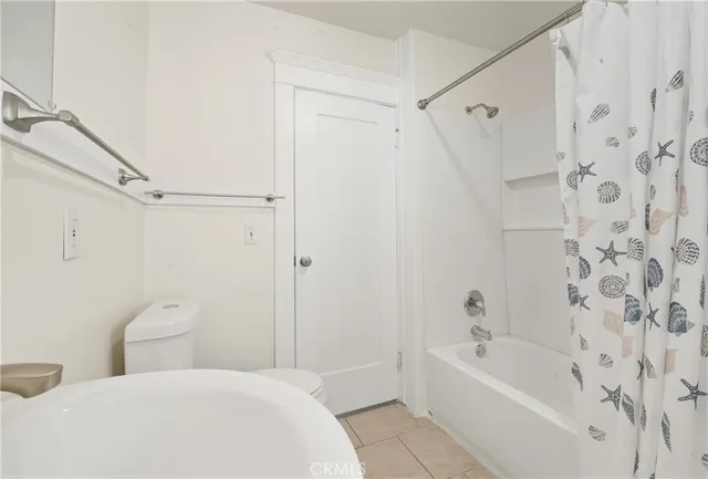 a bathroom with a toilet sink shower and bathtub