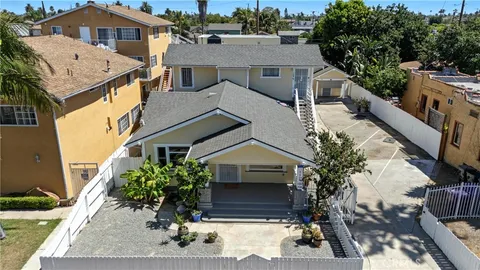 a aerial view of a house with a yard