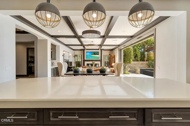 a kitchen with stainless steel appliances granite countertop a sink and cabinets