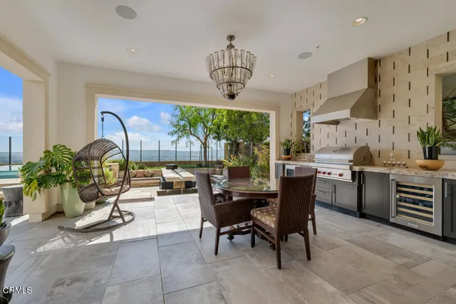a view of swimming pool with outdoor seating and yard in back