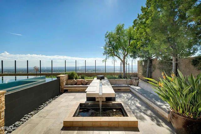 a view of a livingroom with furniture and a chandelier