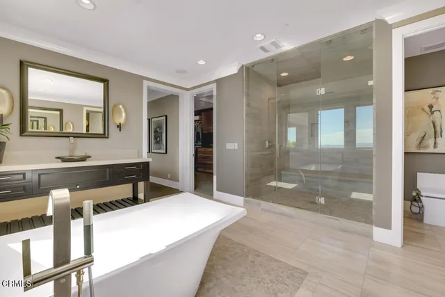 a bathroom with a sink a vanity and a mirror