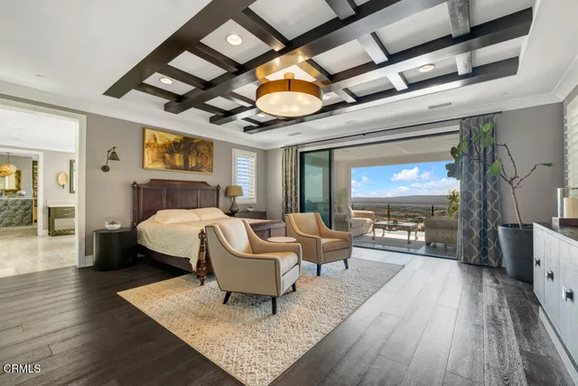 a view of a terrace with couches and wooden fence