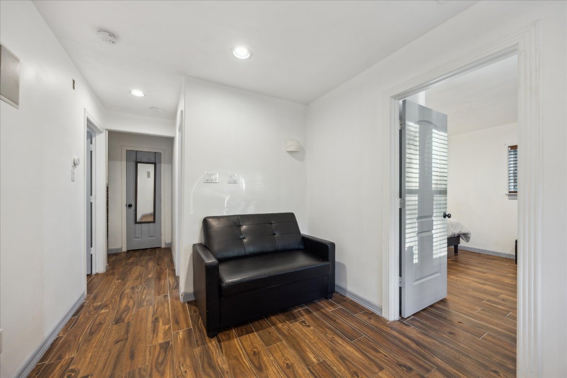 602 Jessie Street Austin, TX 78704 - Photo 22 of 32 a living room with furniture and a wooden floor