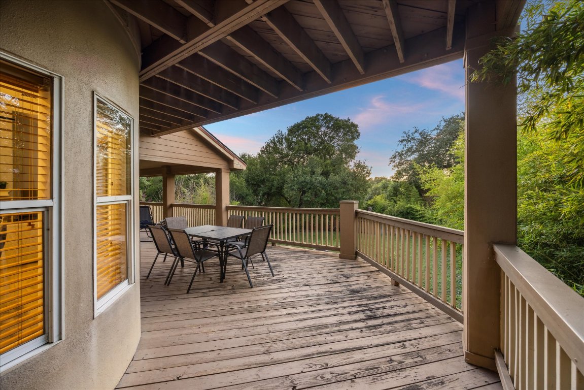 602 Jessie Street Austin, TX 78704 - Photo 26 of 32 a balcony with wooden floor table and chairs