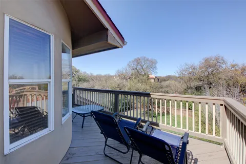 a view of a balcony with furniture