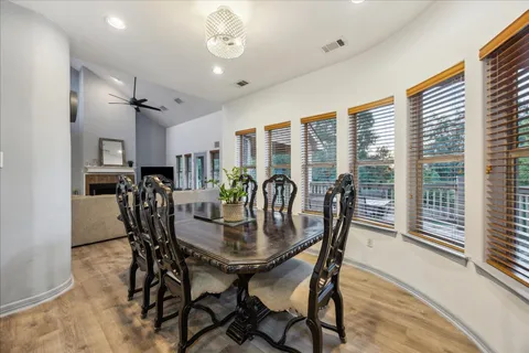 a view of a dining room with furniture window and outside view