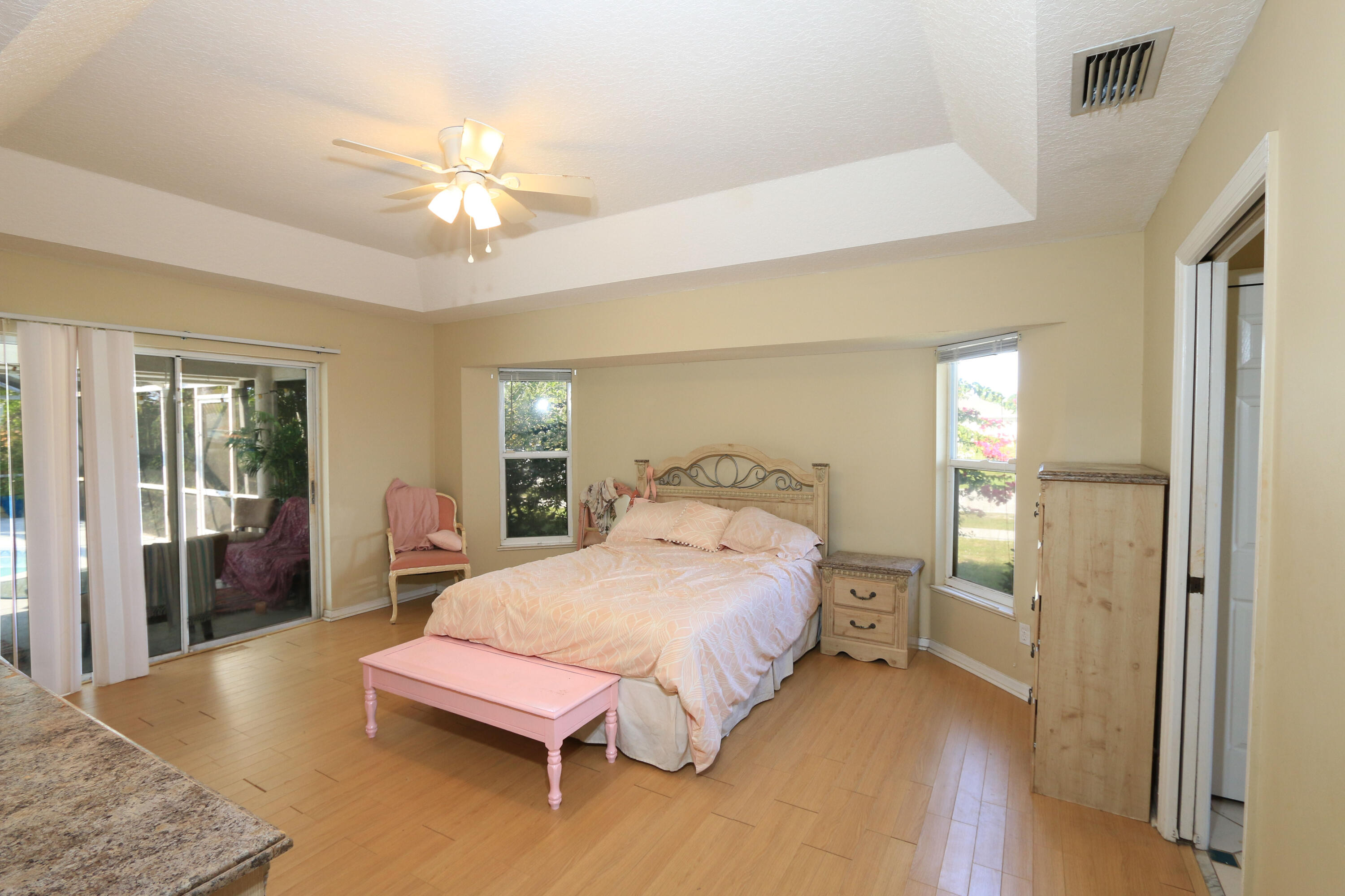 786 Southwest Bond Road Port St. Lucie, FL 34953 - Photo 15 of 33 a bedroom with a bed and window