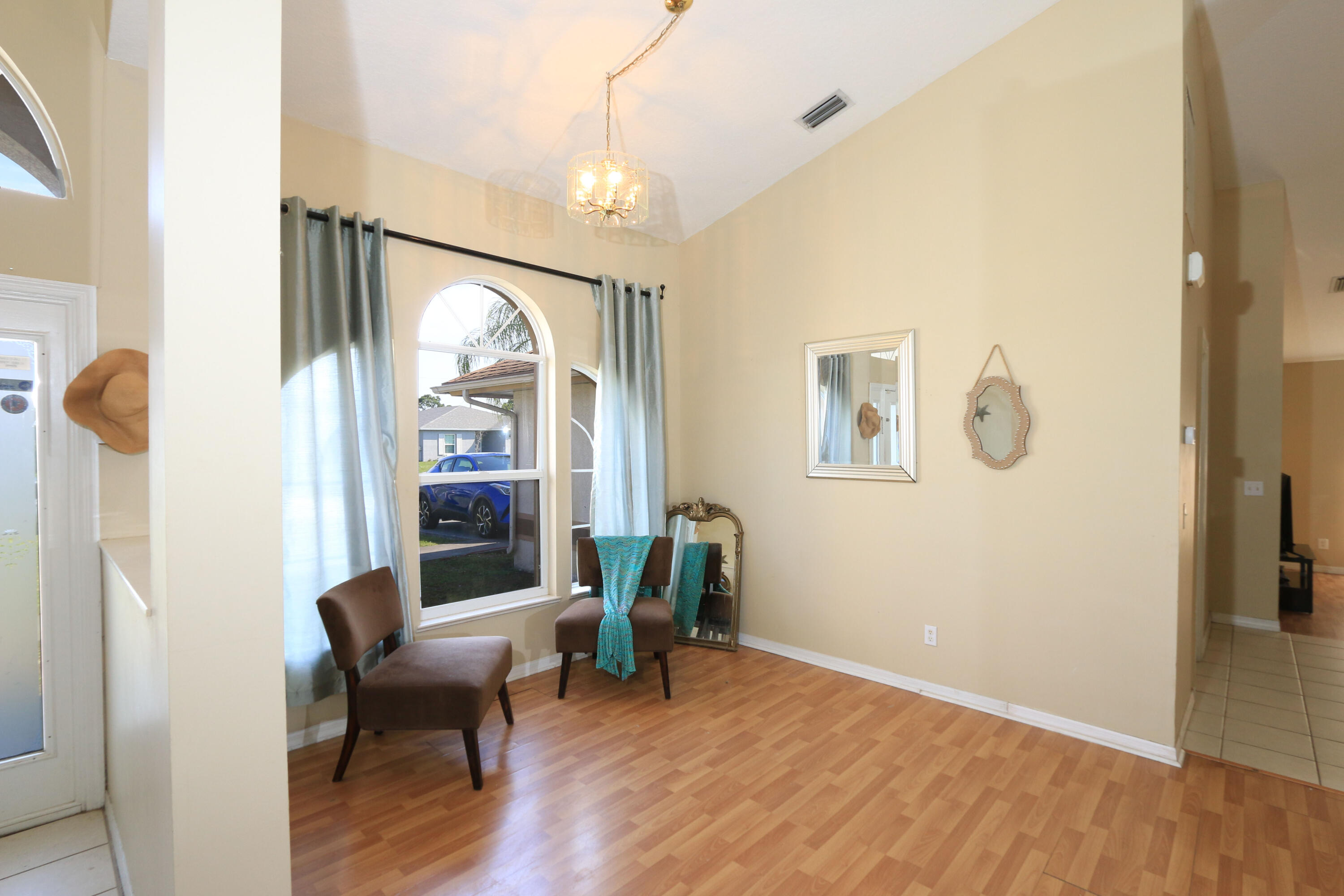 786 Southwest Bond Road Port St. Lucie, FL 34953 - Photo 18 of 33 a view of a livingroom with furniture and window