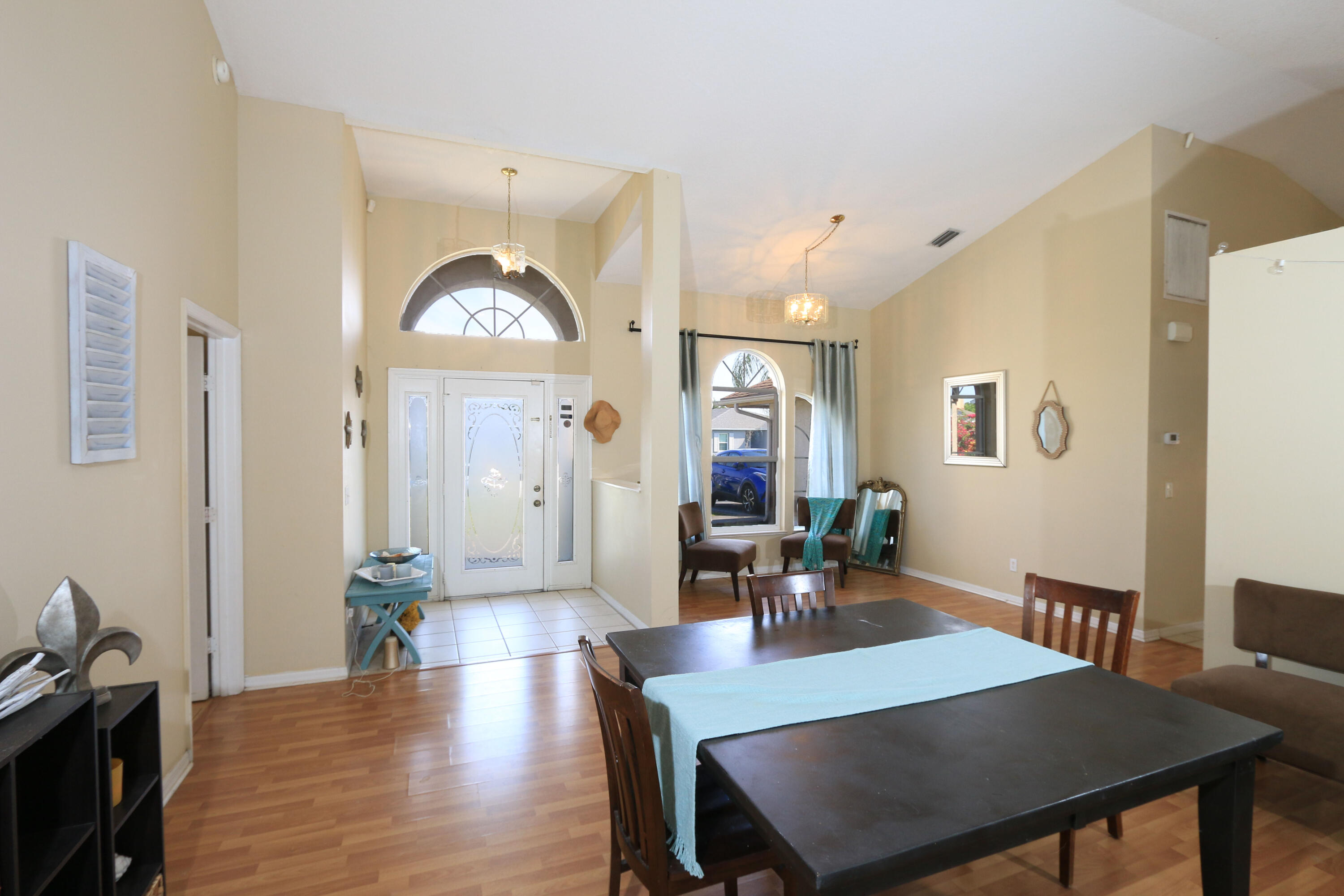 786 Southwest Bond Road Port St. Lucie, FL 34953 - Photo 19 of 33 a view of a dining room with furniture and wooden floor