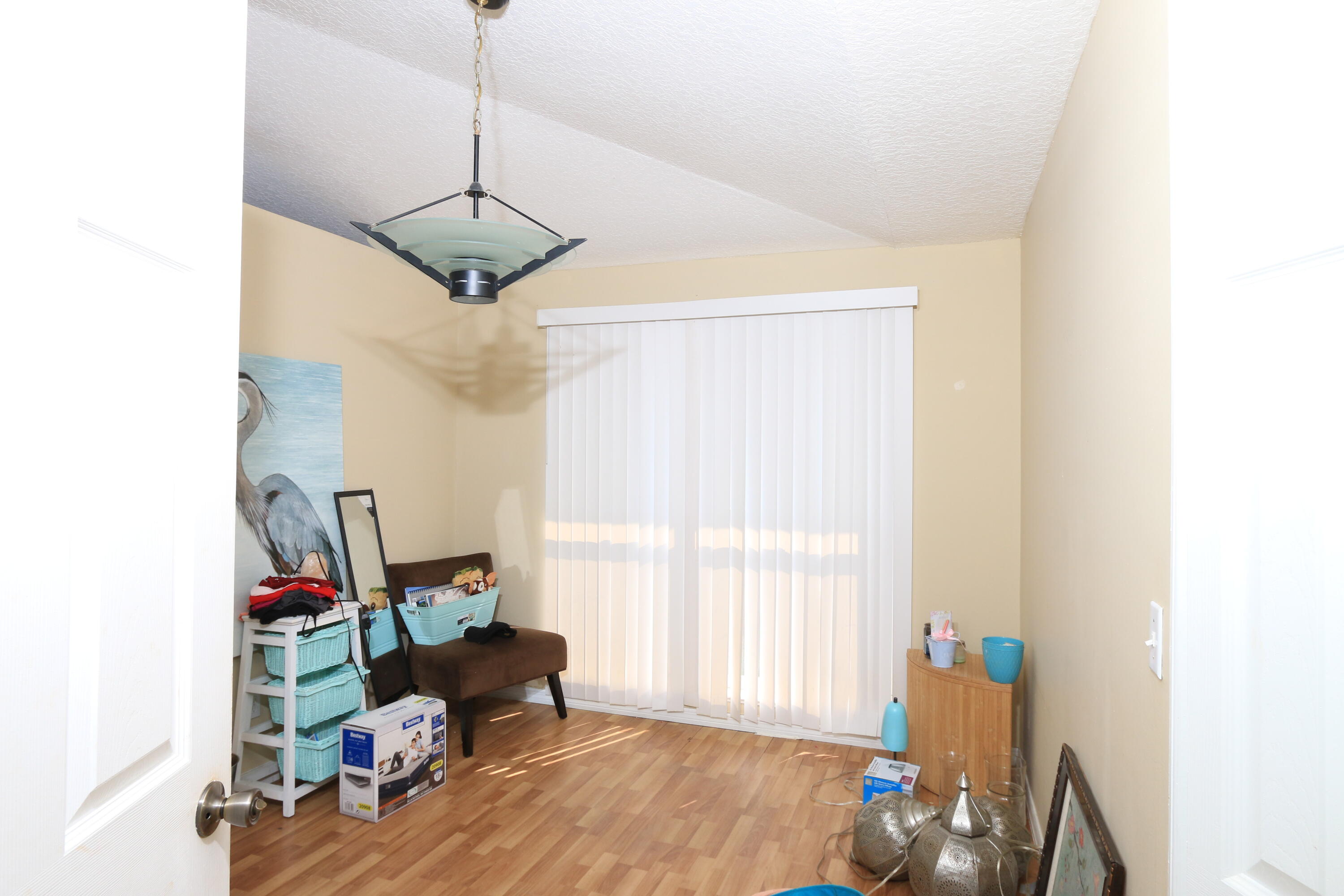 786 Southwest Bond Road Port St. Lucie, FL 34953 - Photo 24 of 33 a living room with furniture and a window