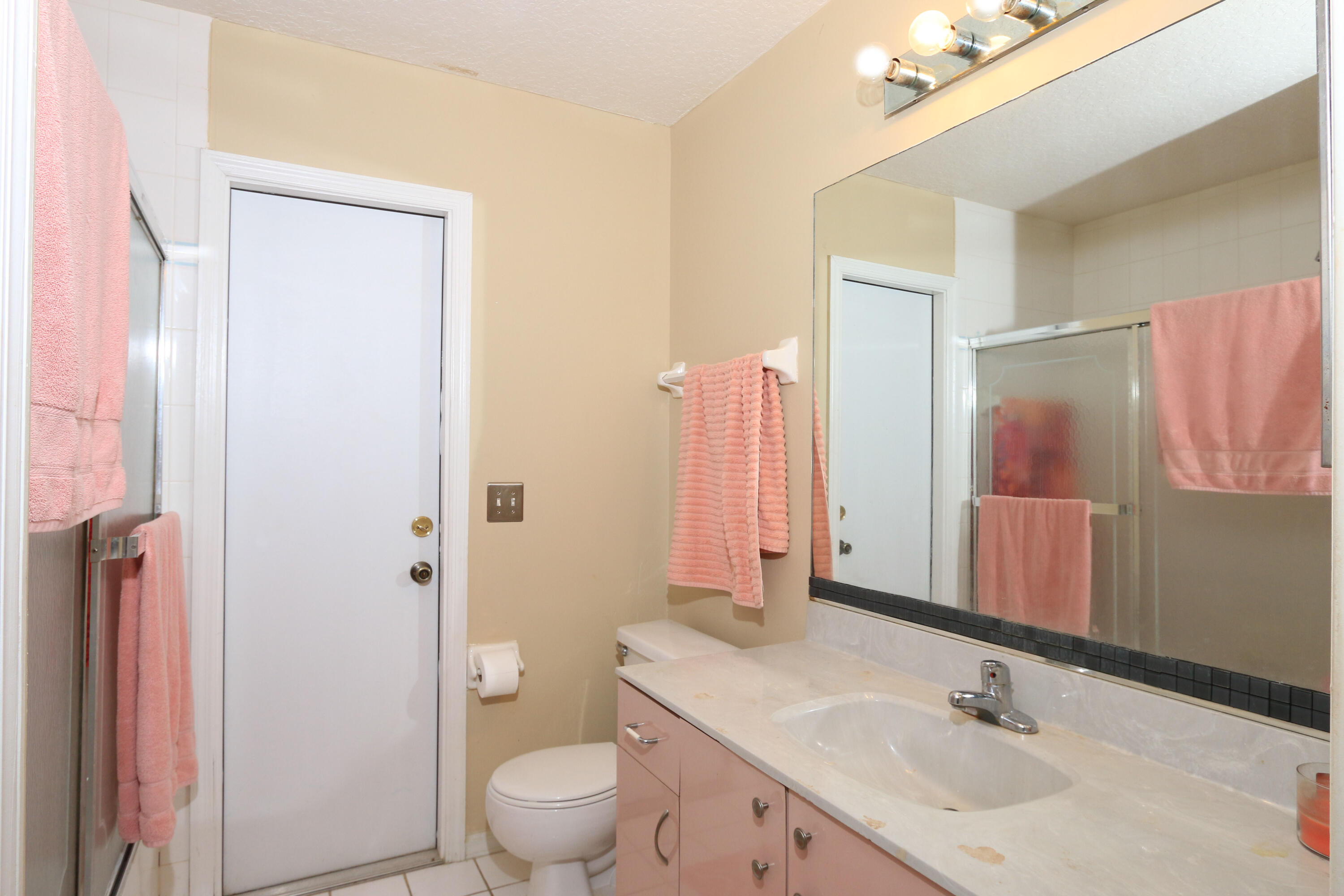 786 Southwest Bond Road Port St. Lucie, FL 34953 - Photo 25 of 33 a bathroom with a sink a toilet and shower