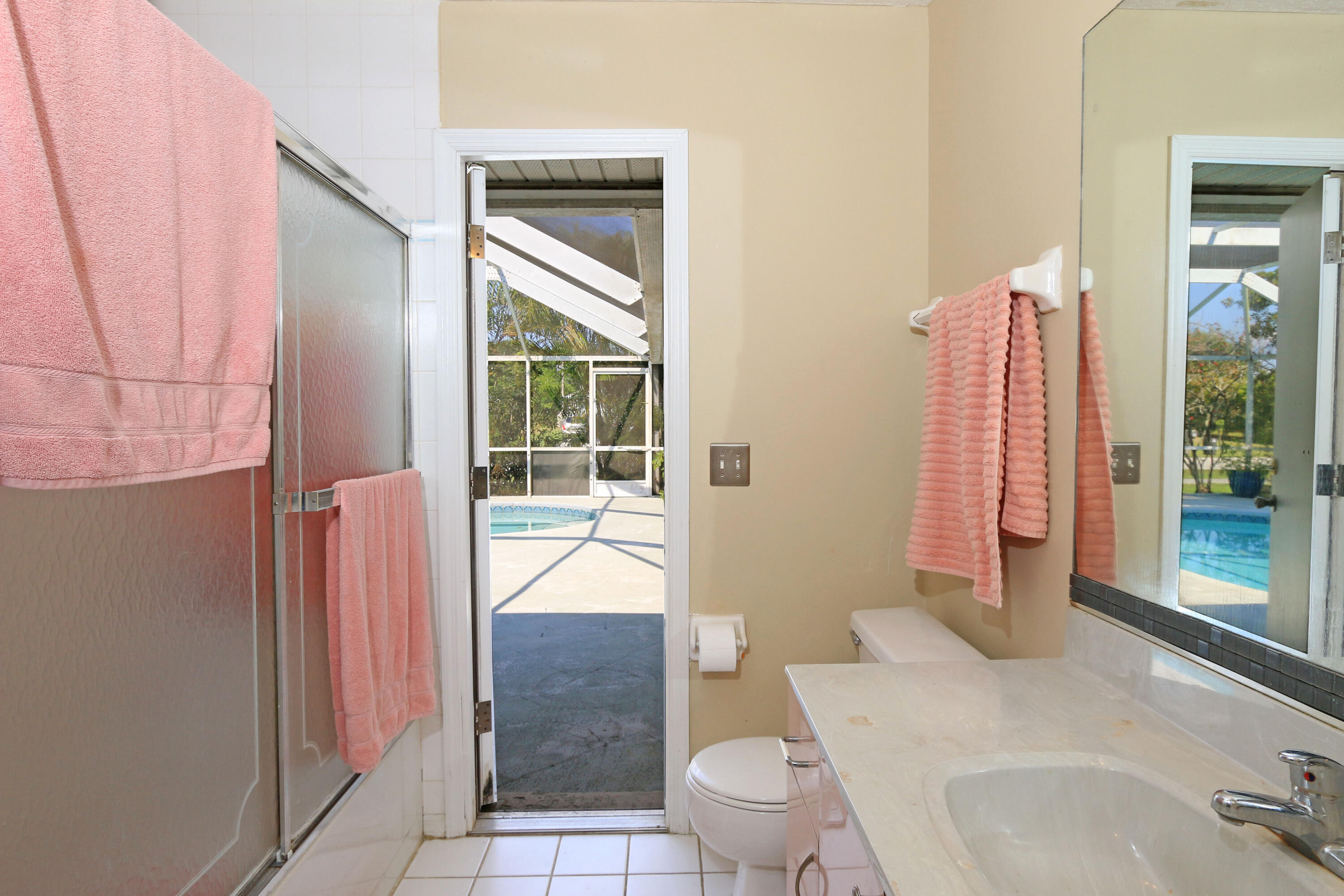 786 Southwest Bond Road Port St. Lucie, FL 34953 - Photo 26 of 33 a bathroom with a sink toilet and shower