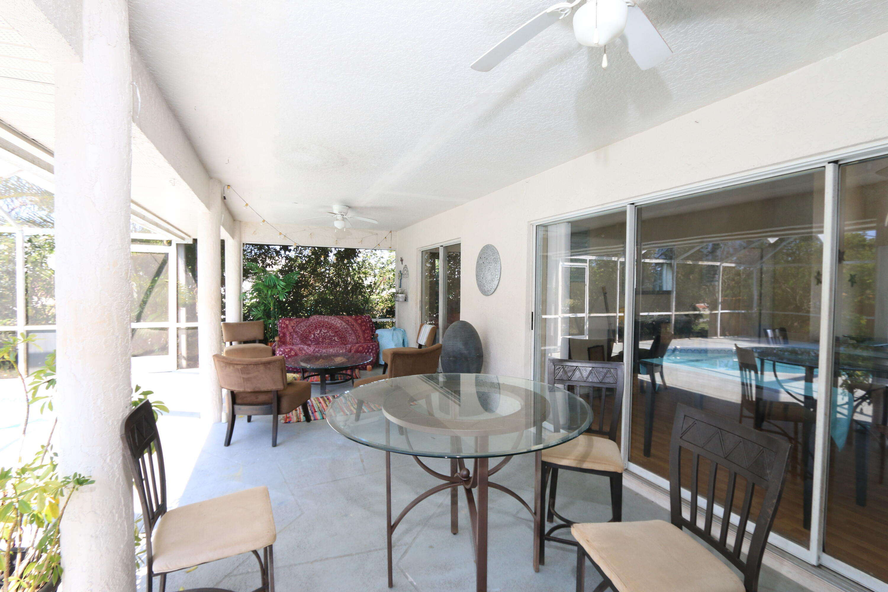 786 Southwest Bond Road Port St. Lucie, FL 34953 - Photo 27 of 33 a balcony with furniture and a potted plant