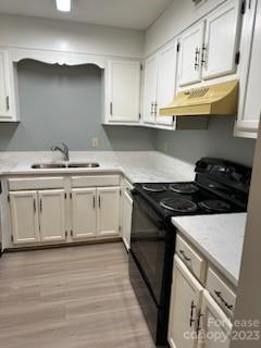 2106 South Main Street Kannapolis, NC 28081 - Photo 16 of 38 a white kitchen with granite countertop a stove and a sink