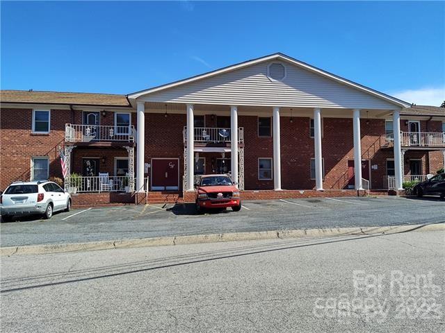 2106 South Main Street Kannapolis, NC 28081 - Photo 2 of 38 a view of a white house with a outdoor space