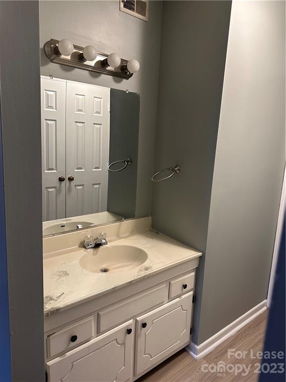 2106 South Main Street Kannapolis, NC 28081 - Photo 31 of 38 a bathroom with a sink and a mirror