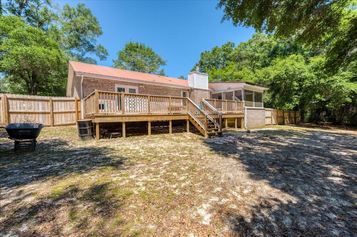 210 Shell Drive Crestview, FL 32536 - Photo 54 of 67 a view of a house with backyard and sitting area