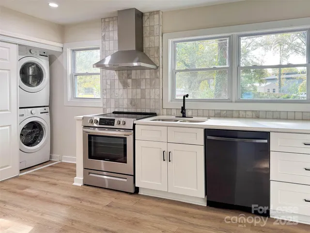 a kitchen with a stove a sink and a microwave