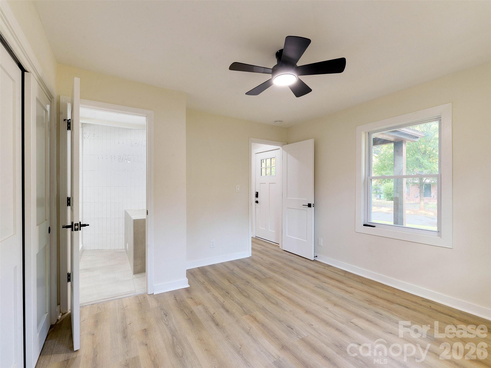 2721 Mayflower Road Charlotte, NC 28208 - Photo 23 of 42 a view of empty room with wooden floor and fan