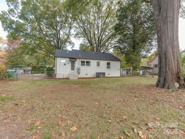 a house with swimming pool in front of it