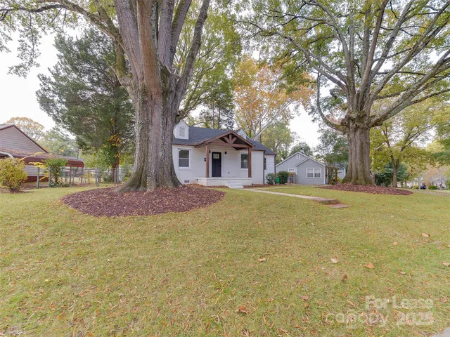 a house with trees in the background