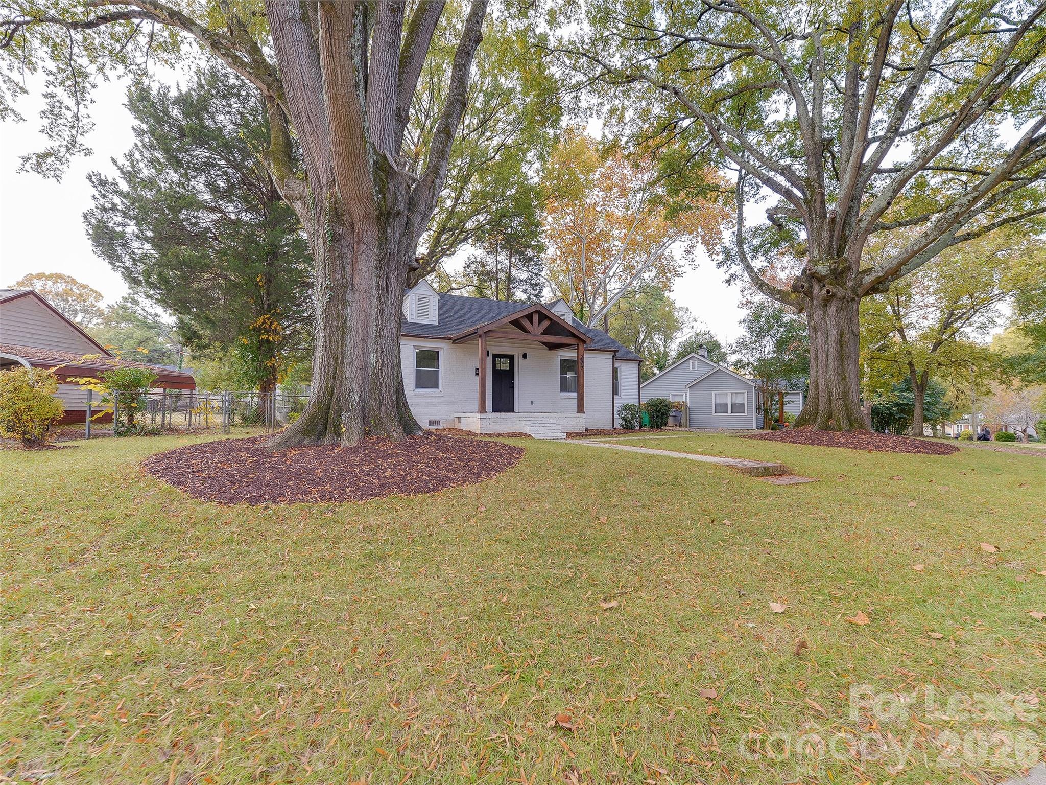 2721 Mayflower Road Charlotte, NC 28208 - Photo 40 of 42 a house with swimming pool in front of it