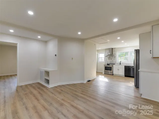 a view of kitchen with wooden floor