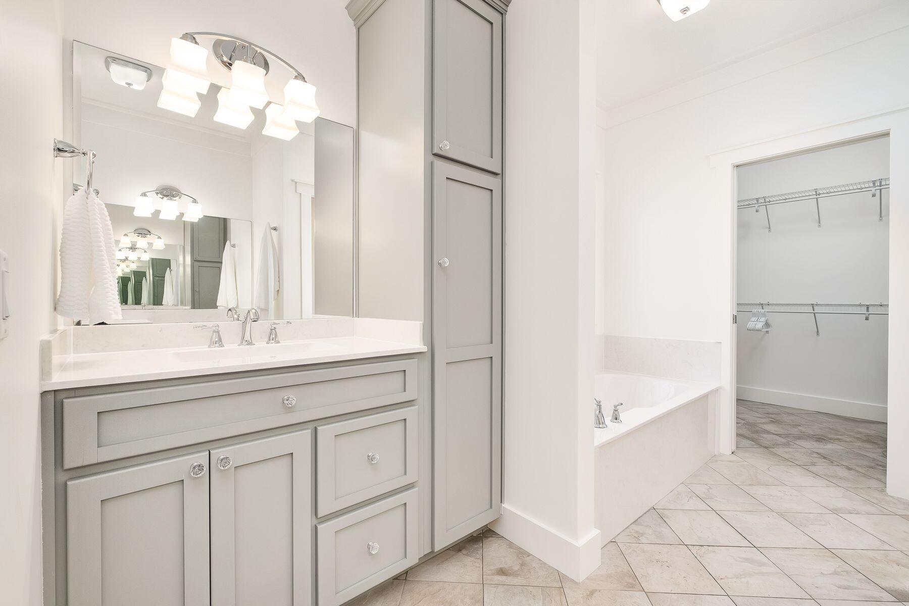 716 Bay Grove Road Freeport, FL 32439 - Photo 15 of 46 a bathroom with a double vanity sink and a mirror