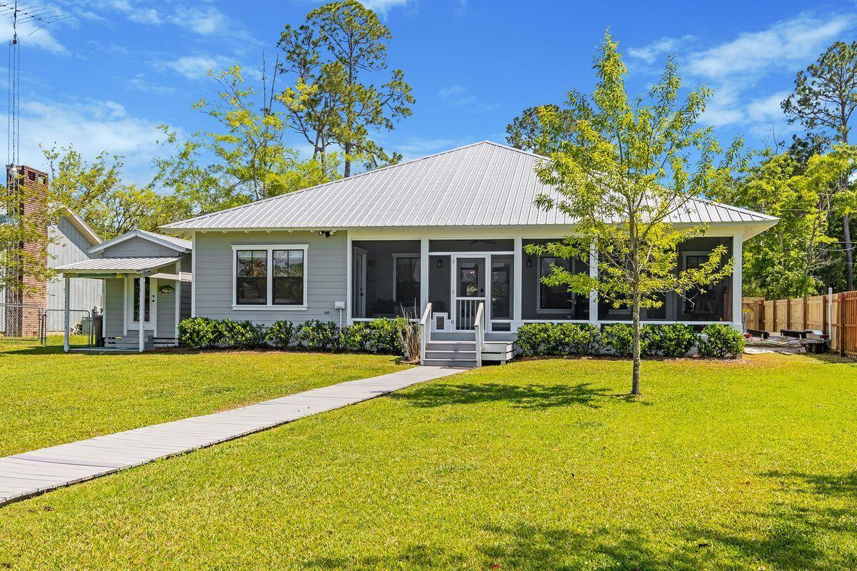 716 Bay Grove Road Freeport, FL 32439 - Photo 29 of 46 a view of a house with a yard patio and swimming pool