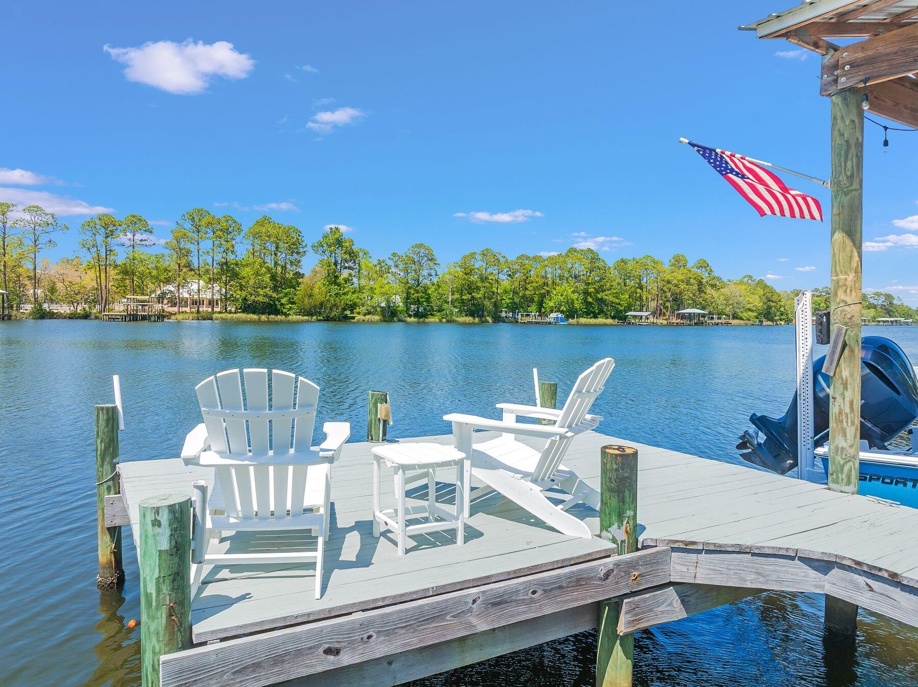 716 Bay Grove Road Freeport, FL 32439 - Photo 31 of 46 a view of a table and chairs on the terrace