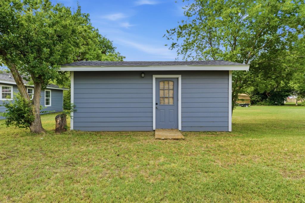 203 North Kickapoo Street Lipan, TX 76462 - Photo 27 of 28 a view of a house with a yard