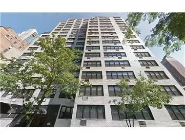 a black and white building with a large windows