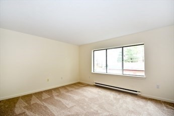 166 Place Lane, Unit 166 Woburn, MA 01801 - Photo 15 of 26 an empty room with a window