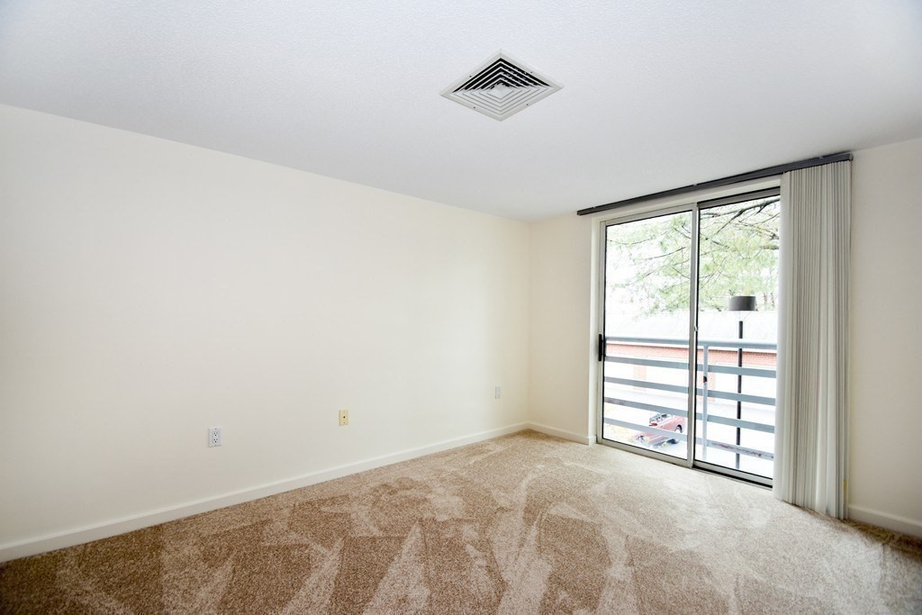 166 Place Lane, Unit 166 Woburn, MA 01801 - Photo 16 of 26 a view of a room with a window