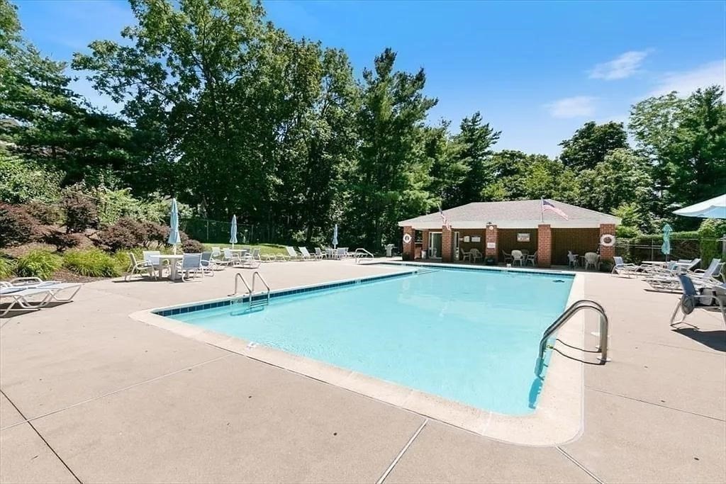 166 Place Lane, Unit 166 Woburn, MA 01801 - Photo 25 of 26 a view of swimming pool with outdoor seating