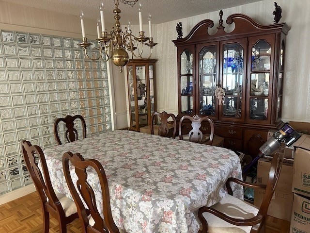 166 Place Lane, Unit 166 Woburn, MA 01801 - Photo 6 of 26 a view of a dining room with furniture and chandelier