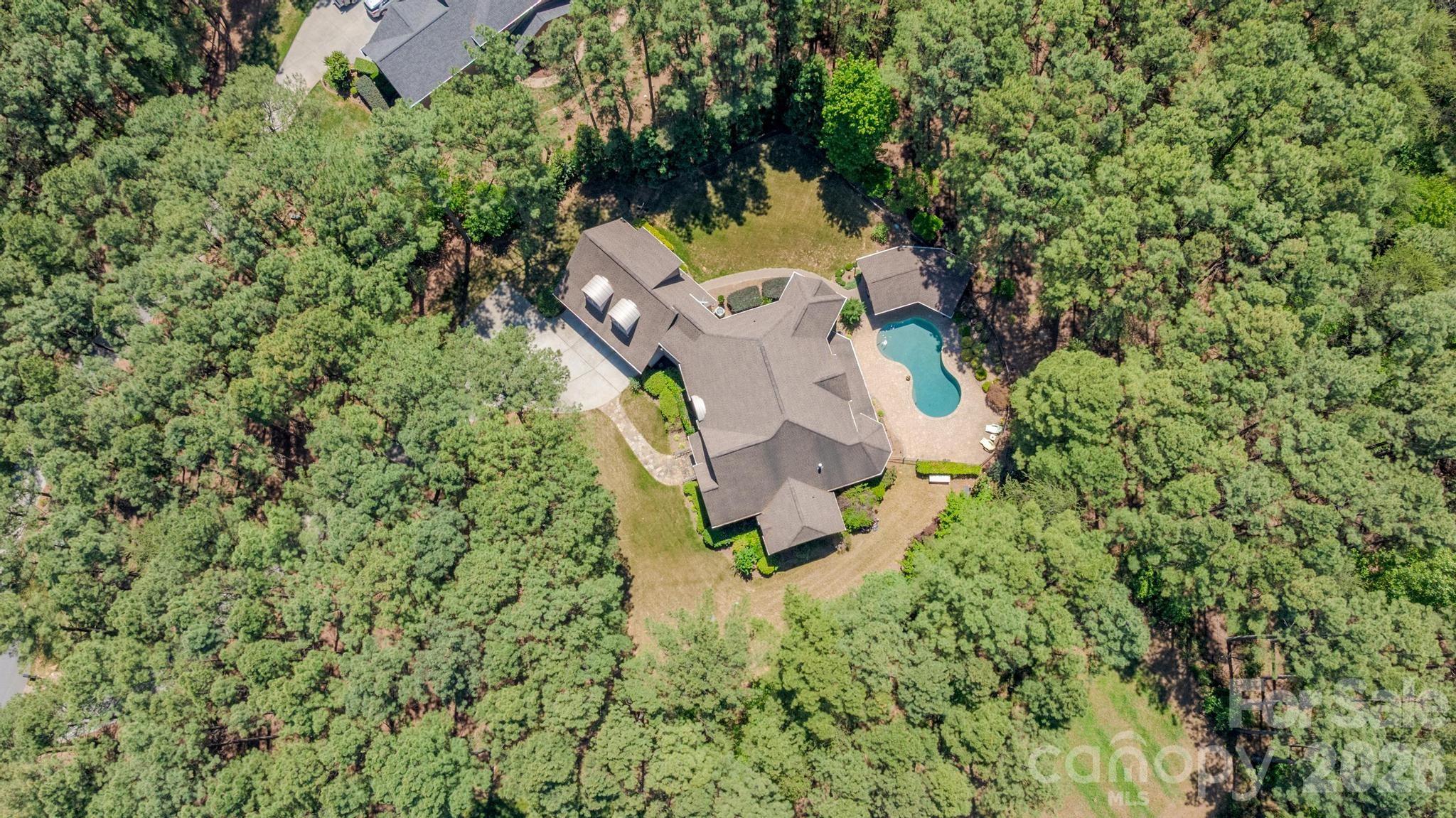 7315 Bay Ridge Drive Denver, NC 28037 - Photo 34 of 39 an aerial view of a house with a yard and large trees
