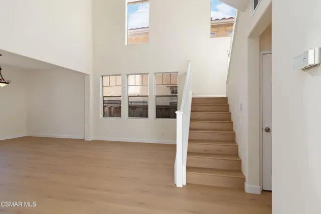 a view of an entryway with wooden floor