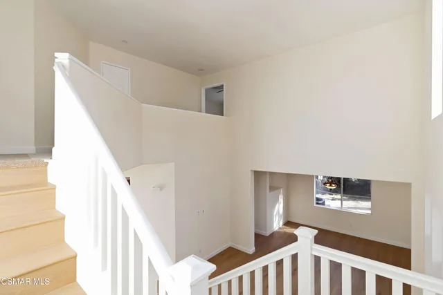 a view of a hallway with staircase