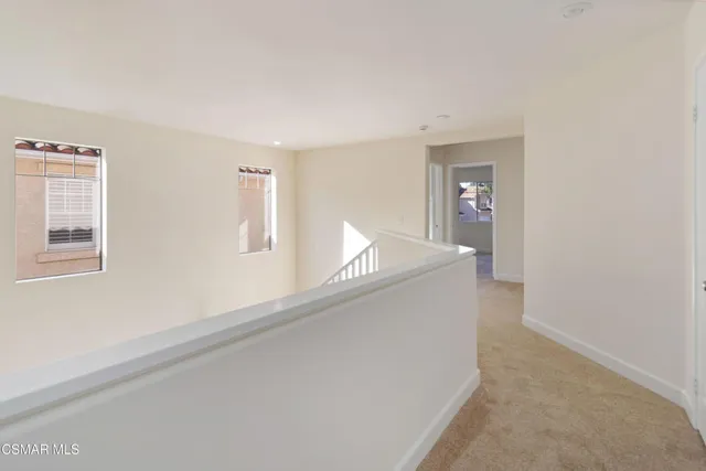 a view of a hallway with staircase