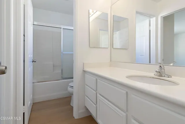 a view of a hallway with closet