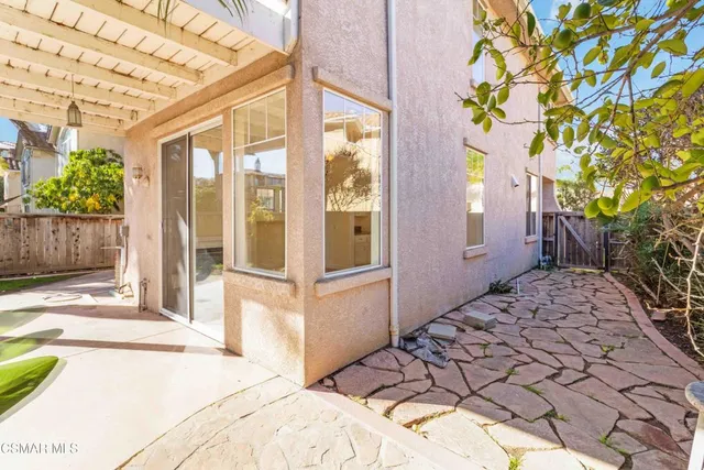 a view of a backyard with a patio