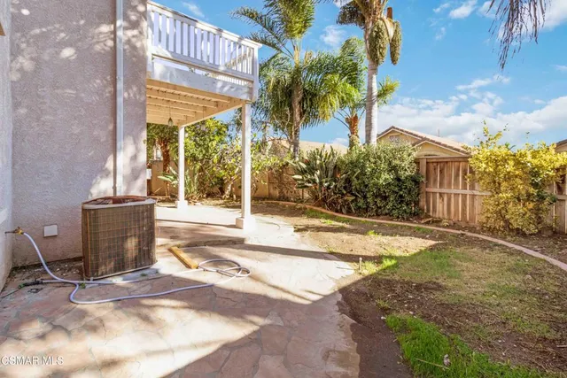 a view of a pathway with a tree in front of it